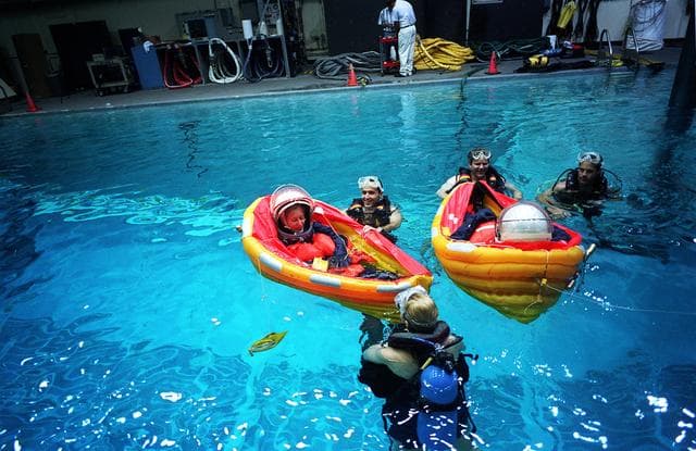 NASA image: STS-81 crewmembers participate in bailout training in Bldg 29 WETF