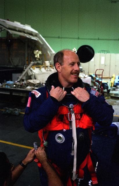 NASA image: STS-82 Suit-up for Post Insertion Training in Crew Compartment Trainer 2