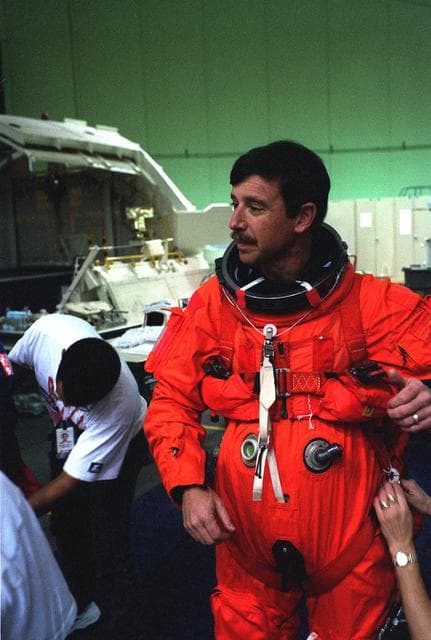 NASA image: STS-82 Suit-up for Post Insertion Training in Crew Compartment Trainer 2