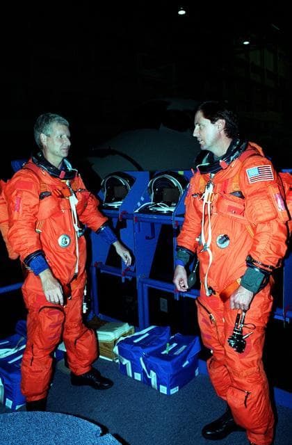 NASA image: STS-82 Suit-up for Post Insertion Training in Crew Compartment Trainer 2
