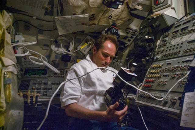 NASA image: Valeri Tokarev on aft flight deck with camera