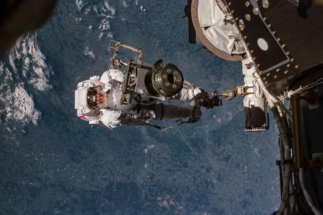 NASA image: Tamara Jernigan transfers STRELA Grapple Fixture adapter during EVA