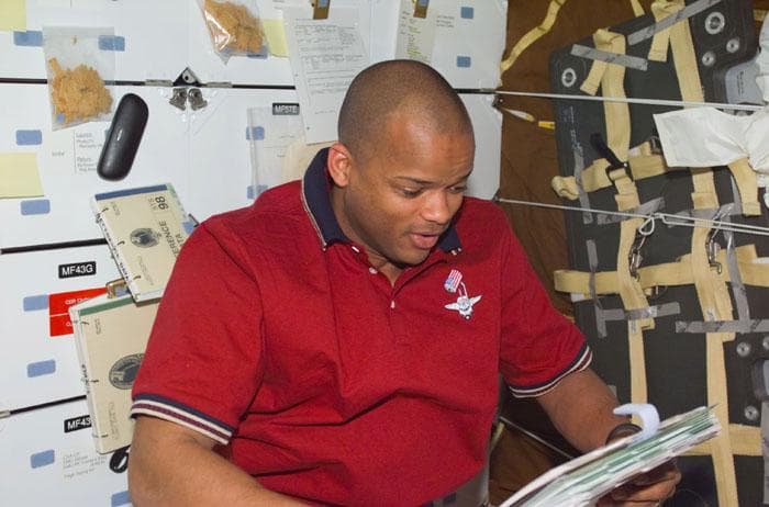 NASA image: MS Curbeam on middeck with checklist