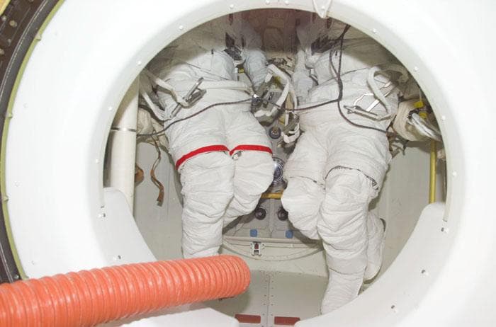 NASA image: EMUs in airlock aboard STS-98 orbiter Atlantis