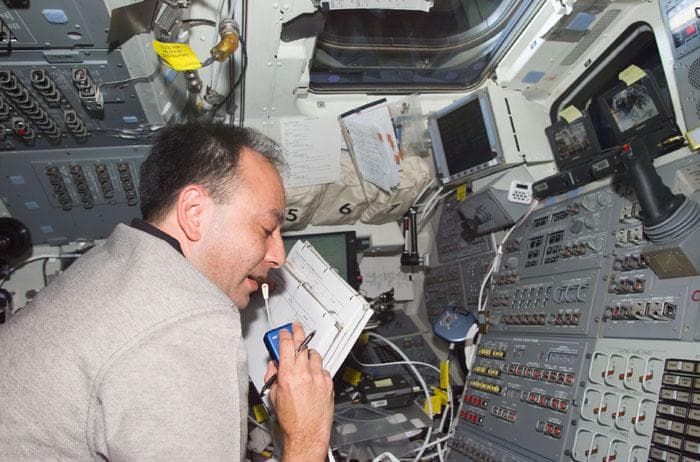 NASA image: PLT Polansky uses microphone while on aft flight deck