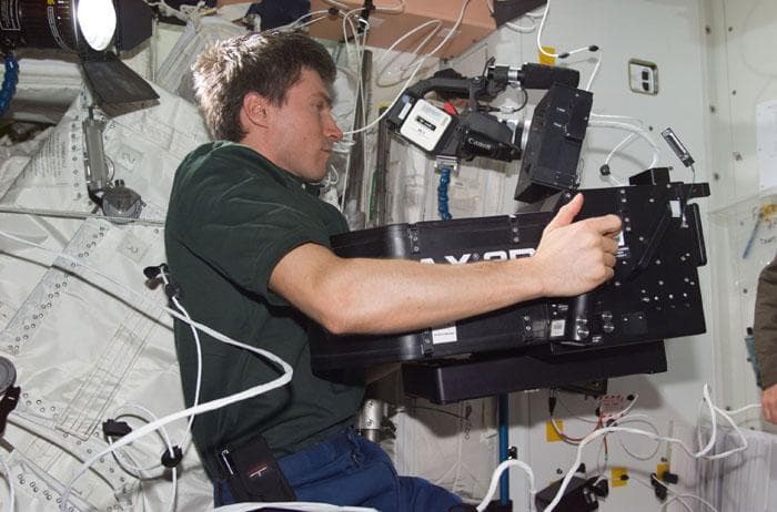 NASA image: Cosmonaut Krikalev with IMAX camera prior to hatch opening