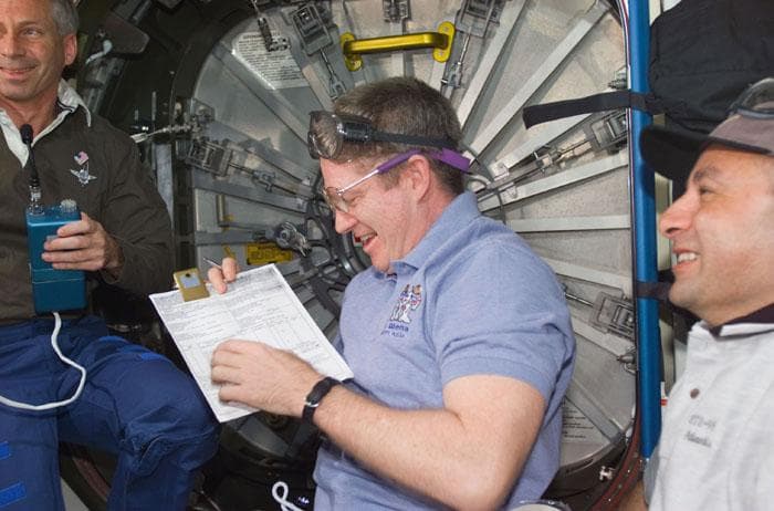 NASA image: Astronauts Cockrell, Shepherd and Polansky prior to hatch opening