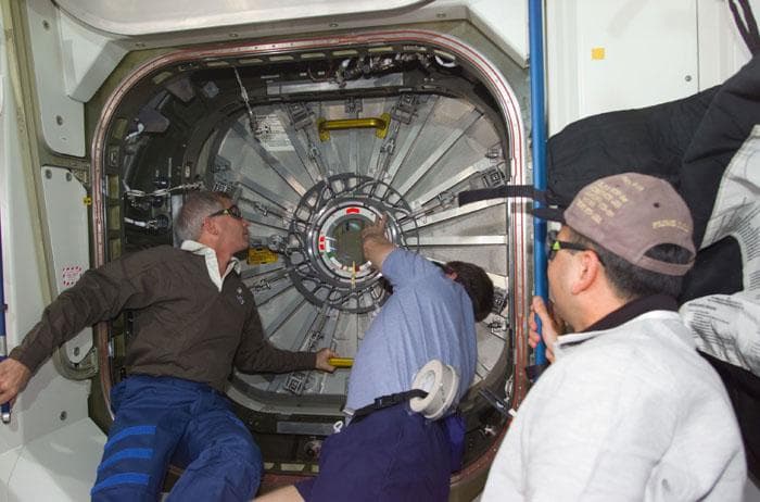 NASA image: Astronauts Cockrell, Shepherd and Polansky during hatch opening