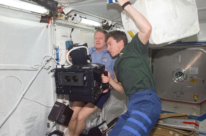 NASA image: Expedition One crewmembers with IMAX camera