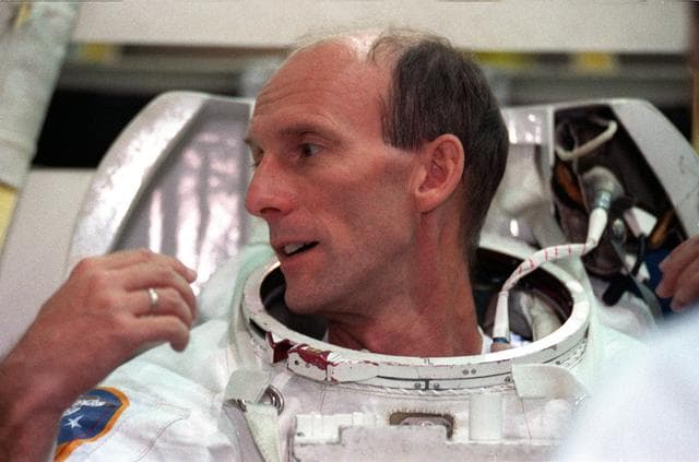 NASA image: STS-99 crewmembers Kavandi and Thiel suit up in EMUs for NBL training