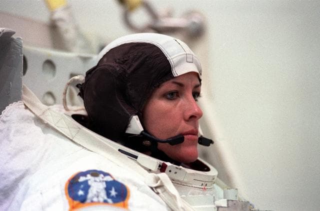 NASA image: STS-99 crewmembers Kavandi and Thiel suit up in EMUs for NBL training
