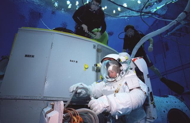NASA image: STS-103 crewmembers during NBL EVA training