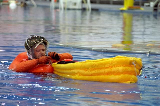 NASA image: STS-97 crewmembers participate in water survival training at NBL