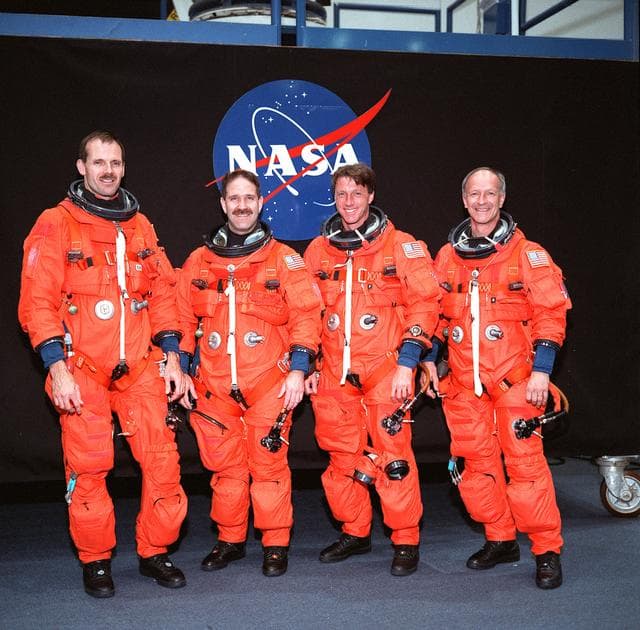 NASA image: STS-103 crewmembers participate in bailout training in building 9N