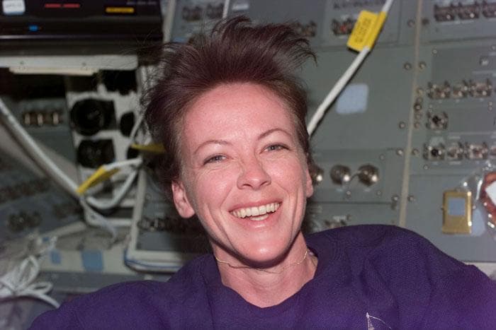 NASA image: STS-99 MS Kavandi poses for a photo on OV-105's aft flight deck