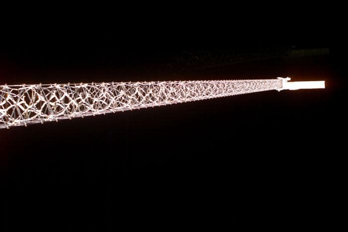 NASA image: Views of the SRTM antenna on the end of a 200 ft. mast during STS-99