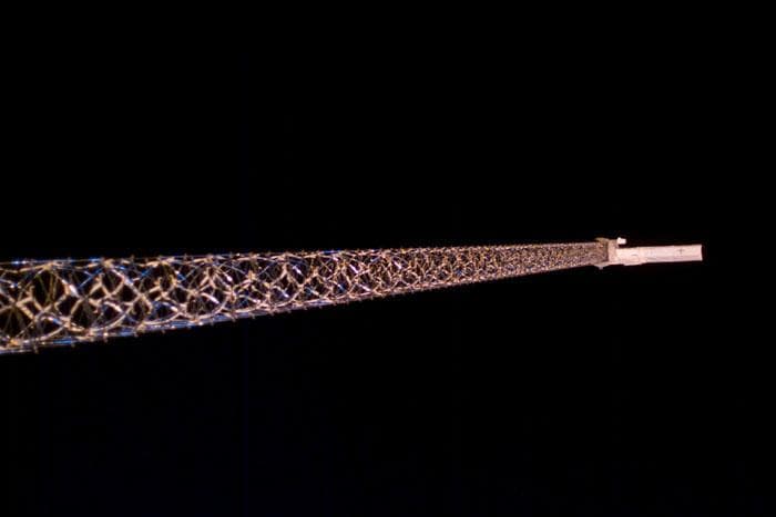 NASA image: Views of the SRTM antenna on the end of a 200 ft. mast during STS-99