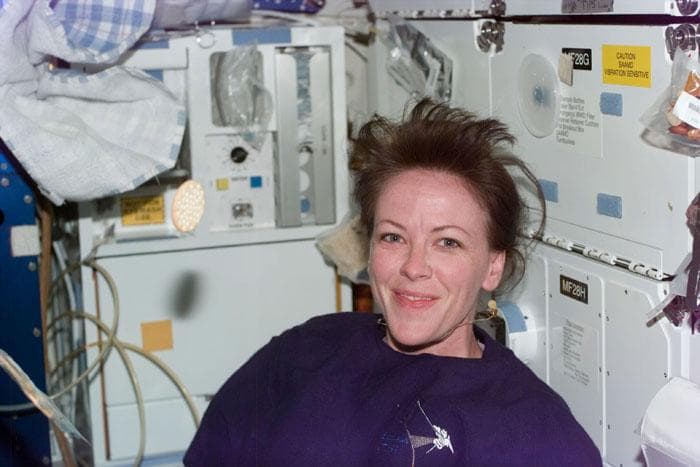 STS-99 MS Kavandi poses for a photo on OV-105's middeck
