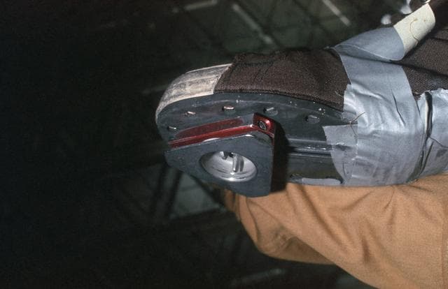 NASA image: View of triangle-shaped weight on bottom of astronauts shoe
