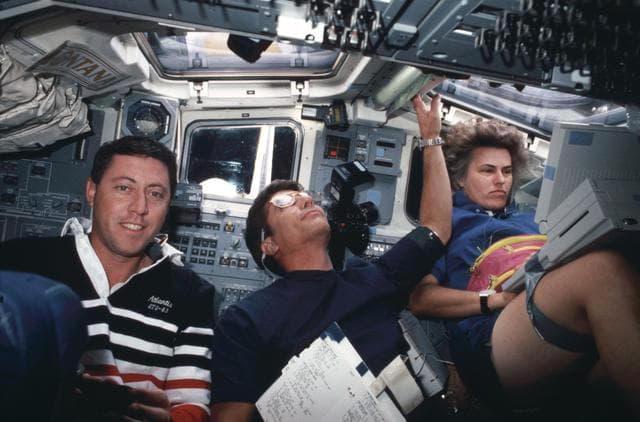 NASA image: STS-43 crewmembers perform various tasks on OV-104's aft flight deck