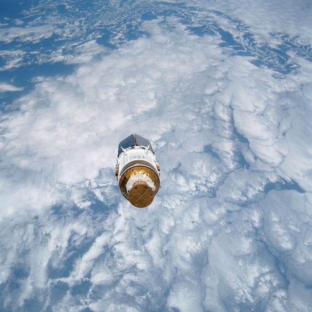 NASA image: STS-43 TDRS-E & IUS over the Pacific Ocean after deployment from OV-104's PLB