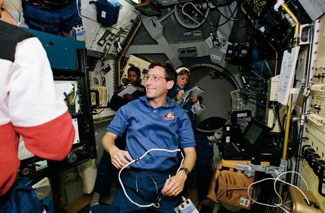 NASA image: STS-47 crewmembers work in the Spacelab Japan (SLJ) module aboard OV-105