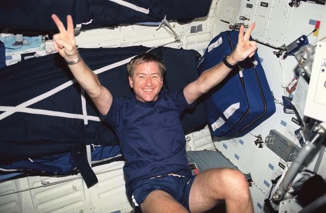 NASA image: Astronaut Frank Culbertson on the ergometer in STS-51 Discovery's middeck