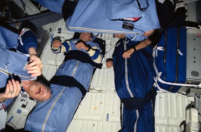 NASA image: STS-51 astronauts photographed during sleep period on Discovery's middeck