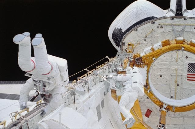 NASA image: EVA Crewmembers working in the payload bay.