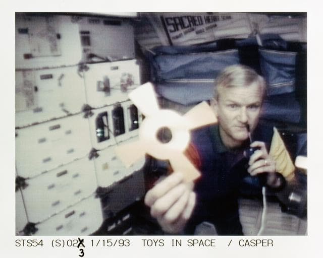 STS-54 Commander Casper with DSO 802 & Physics of Toys on OV-105's middeck