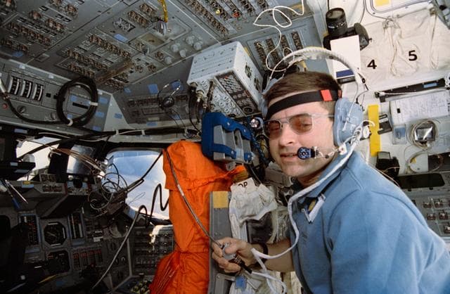 NASA image: STS-56 Commander Cameron uses SAREX on OV-103's aft flight deck