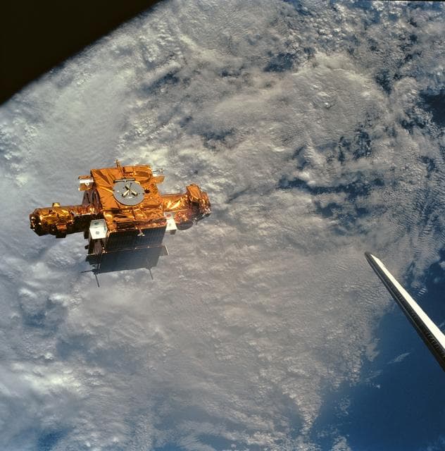 NASA image: STS-56 view of freeflying SPARTAN-201 backdropped against heavy cloud cover