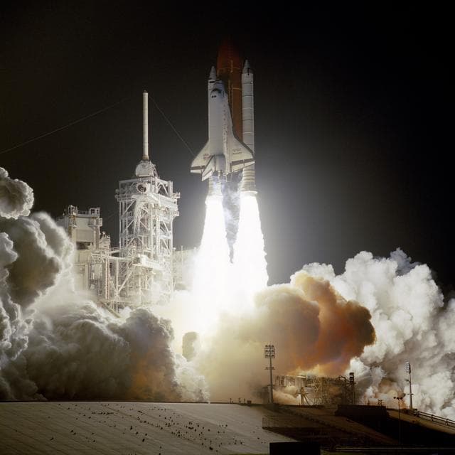 NASA image: STS-56 Discovery, OV-103, lifts off from KSC LC Pad 39B into darkness