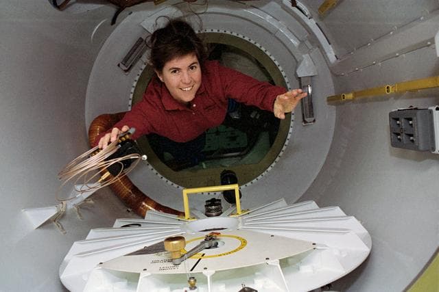 NASA image: Candid views of a crewmember in the SPACEHAB access tunnel.