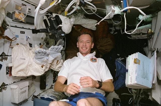 NASA image: STS-57 Pilot Duffy checks out EMU equipment on the middeck of OV-105