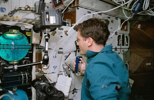 NASA image: STS-57 MS3 Wisoff monitors FARE II activity on the middeck of OV-105