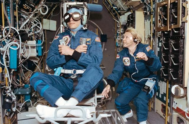 NASA image: Crewmember in SPACELAB wearing the Acceleration Recording Unit and Collar.