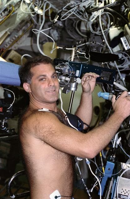 NASA image: Astronaut David Wolf in medical experiment in SLS-2