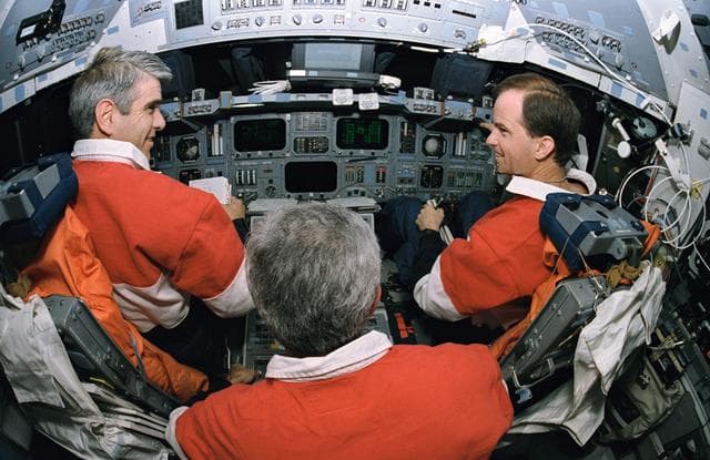 NASA image: Fisheye view of flight deck and astronauts Gutierrez, Chilton and Clifford