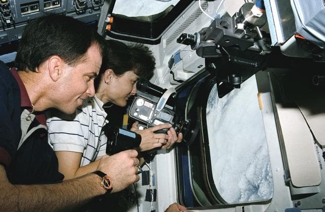 NASA image: Astronauts Chilton and Godwin monitor and photograph clouds on earth