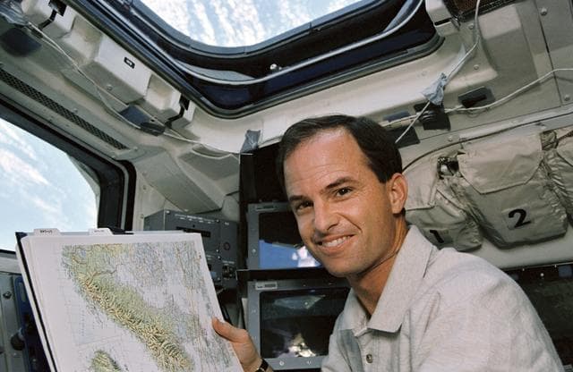 NASA image: Astronaut Kevin Chilton displays map of Scandinavia on flight deck
