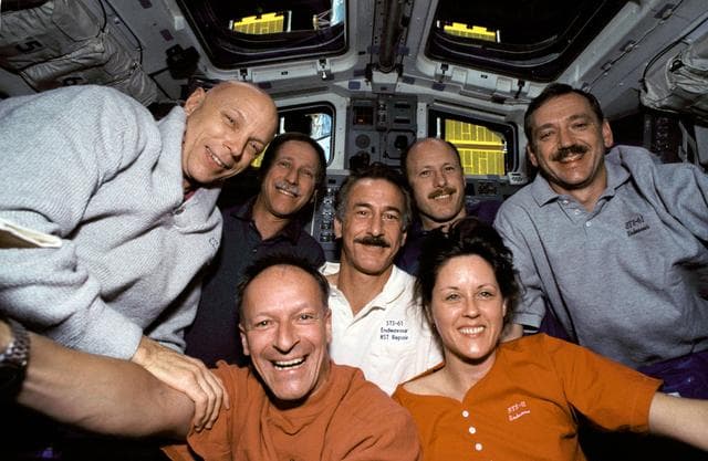 On-board STS-61 crew portrait