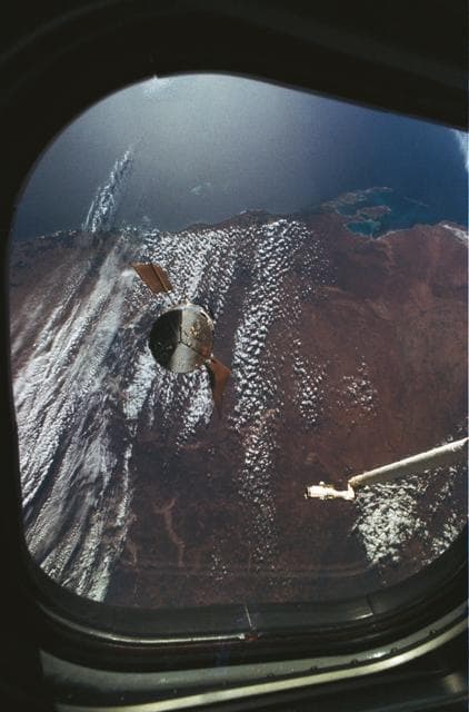 NASA image: View of HST as it approaches Endeavour, taken from aft flight deck window
