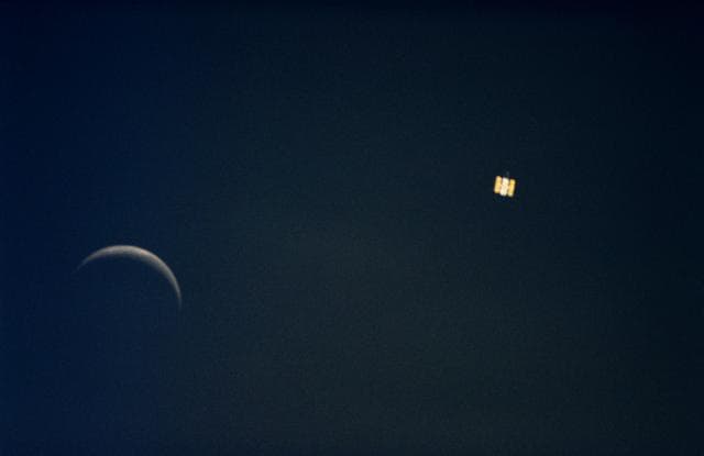 NASA image: Onboard view from STS-61 of the Hubble Space Telescope and moon together