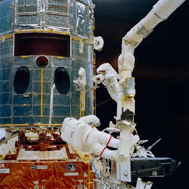 NASA image: Astronauts Hoffman and Musgrave during EVA to repair Hubble Space Telescope