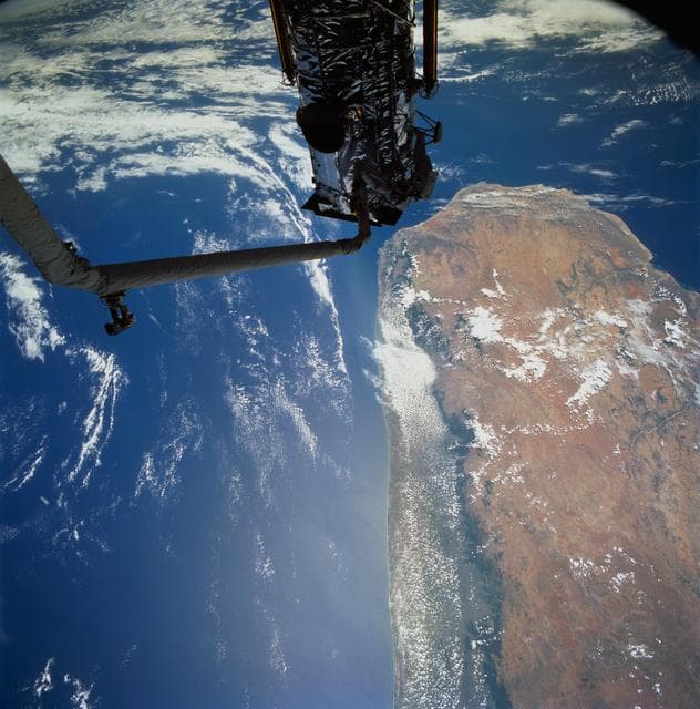 NASA image: Astronauts Hoffman and Musgrave install the Magnetic Sensing System on HST