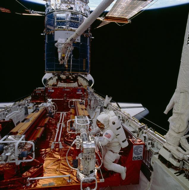 NASA image: Astronauts Musgrave and Hoffman during first STS-61 EVA