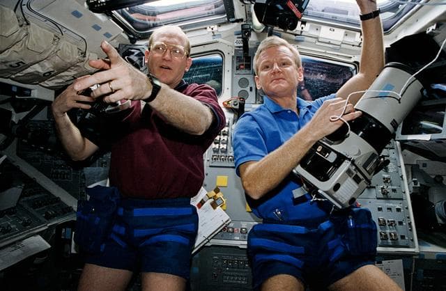 NASA image: Astronauts Casper and Gemar prepare to use cameras