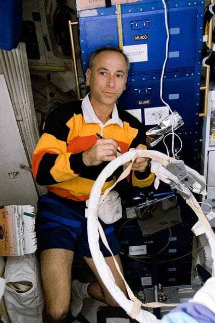 NASA image: Astronaut Meade checks hose on SAFER prior to EVA