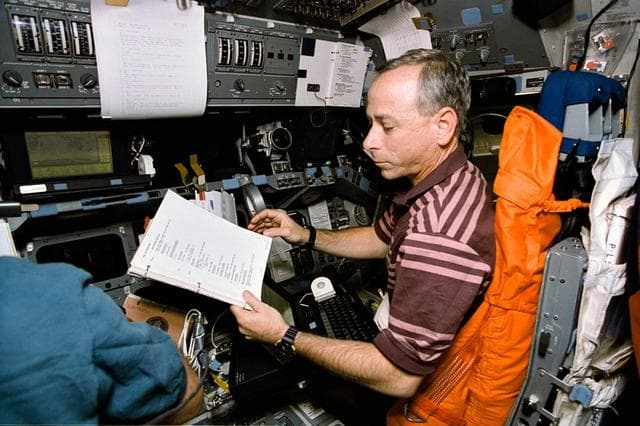 NASA image: Astronaut Carl Meade mans pilots station during trajectory control exercise